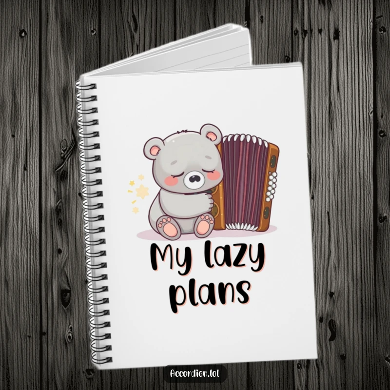 Funny grey bear character holding a pen and sleeping near a closed ornate brown accordion on a notebook cover.